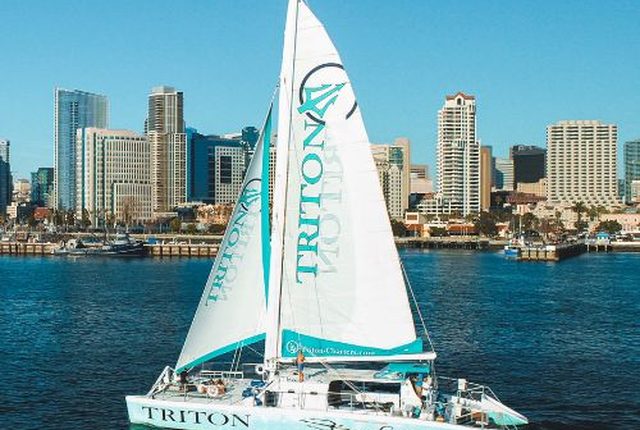 The Triton catamaran sailing on San Diego Bay past the downtown skyline
