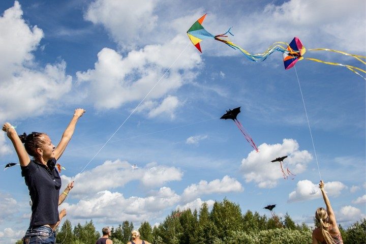 Flying kites on a clear day