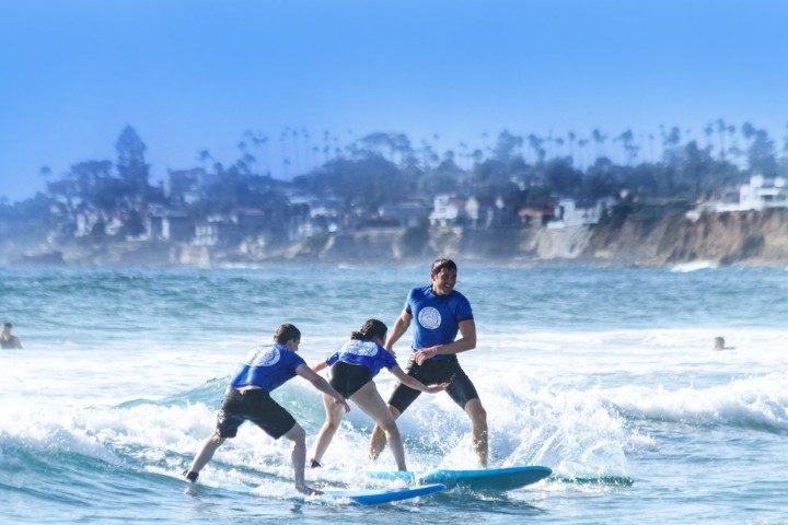 Surf lesson in the waves at Pacific Beach