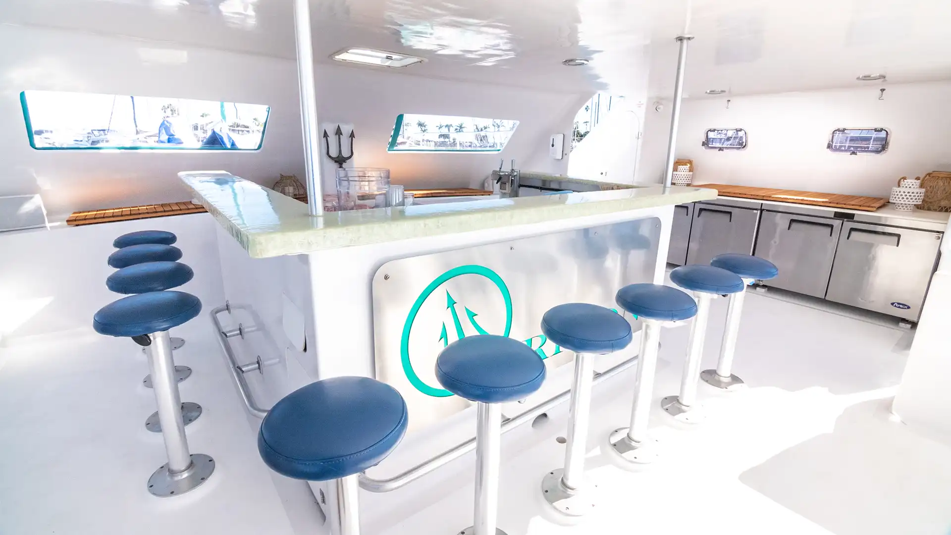 Triton's shaded salon and 13-seat bar with navy stools