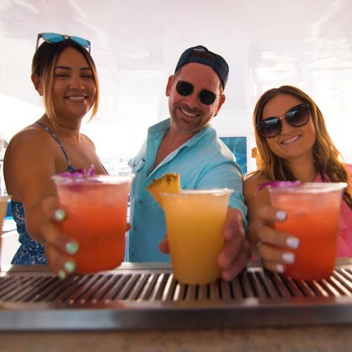 Guests toasting drinks on a San Diego harbor cruise