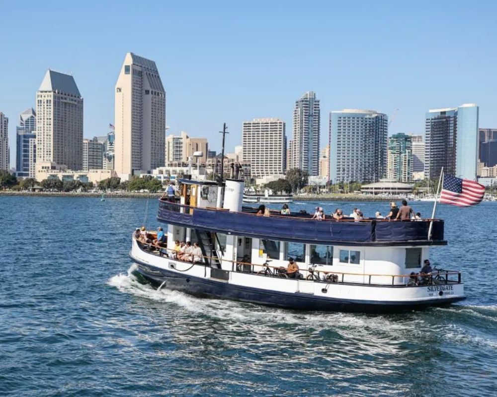 The Coronado ferry crossing San Diego Bay with the downtown skyline behind it